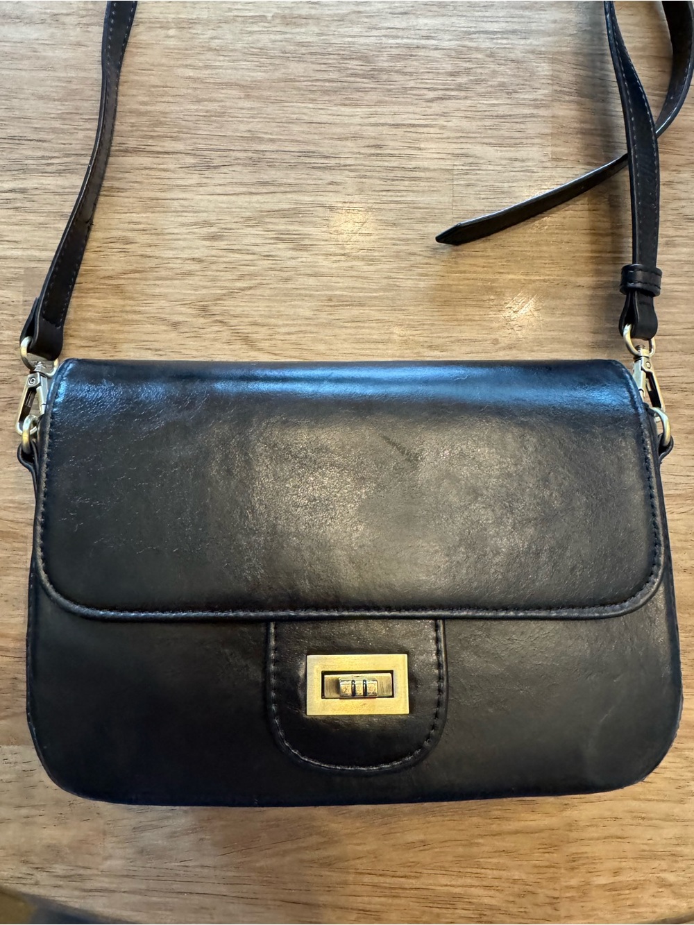 Black Leather Crossbody Bag with Gold Turn-Lock Closure